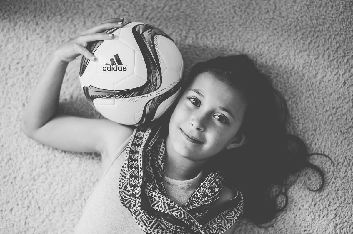 Photographers in Greensboro NC with tween girl with soccer ball
