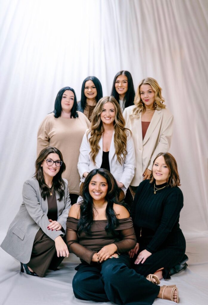 Group image of Mae's Beauty Bar team supporting hair and makeup for senior photos